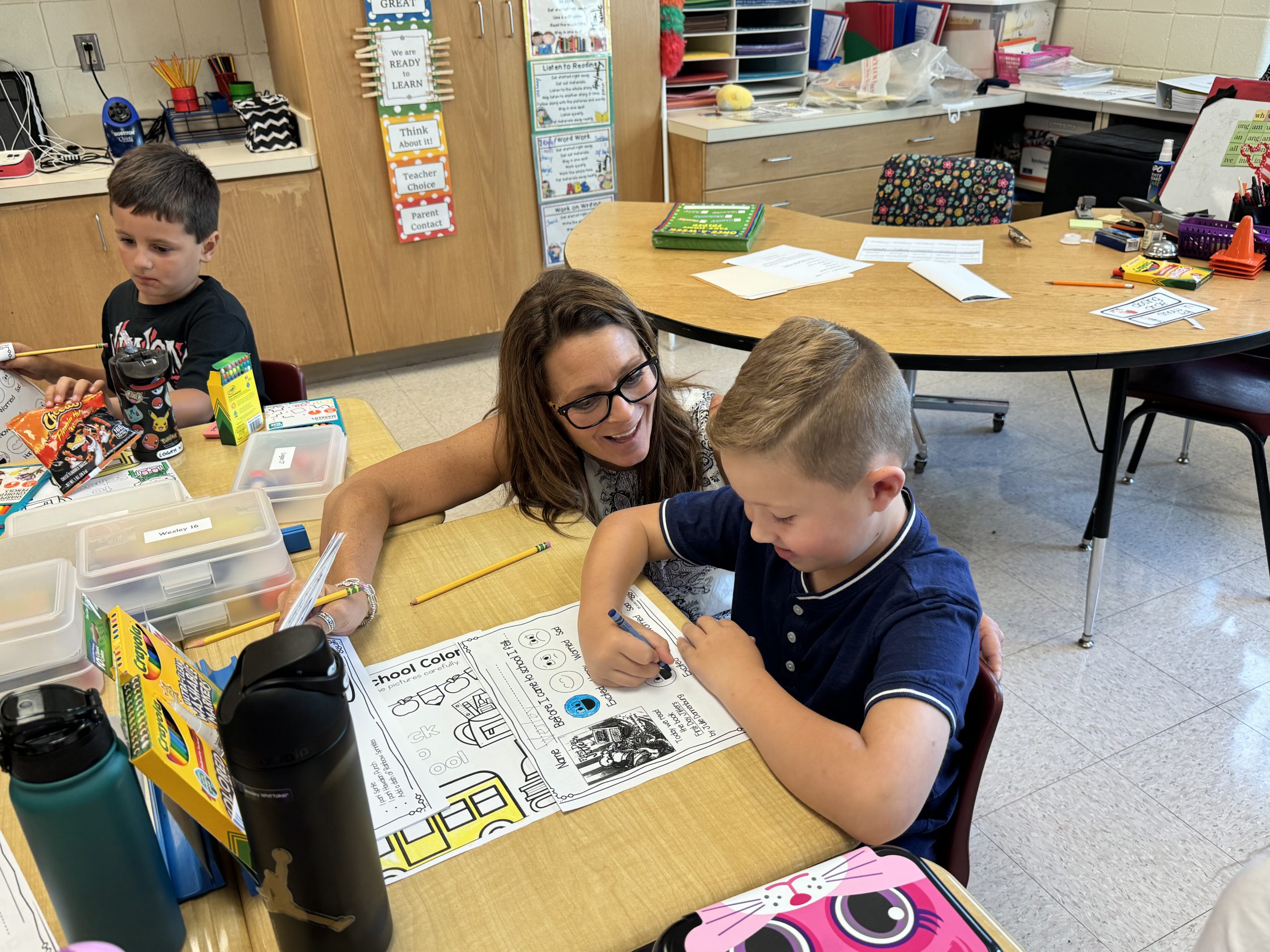 Mrs. Cogan-Carpenter works with a student