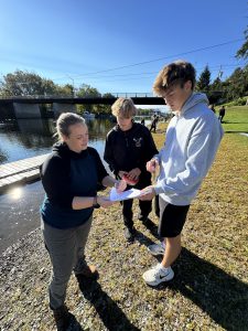 Students examine data from the Hudson River with teacher Carlyn Miller