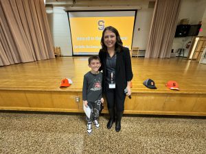 Stacy Marzullo with an elementary student