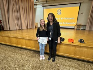 Stacy Marzullo with an elementary student